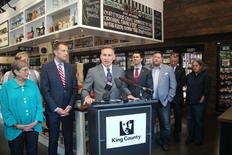 Dow Constantine and public officials at press conference.