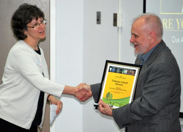 Mike Maryanski, superintendent of the Tahoma School District receives a Certificate of Recognition.